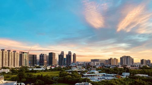 Cityscape against sky during sunset