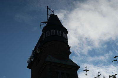 Low angle view of historic building against cloudy sky