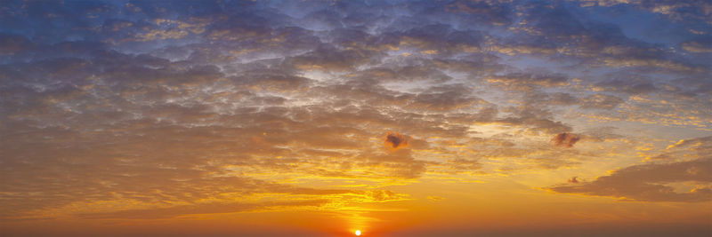 Low angle view of dramatic sky during sunset