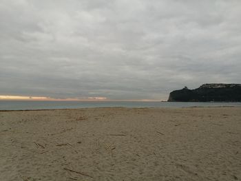 Scenic view of beach against sky during sunset