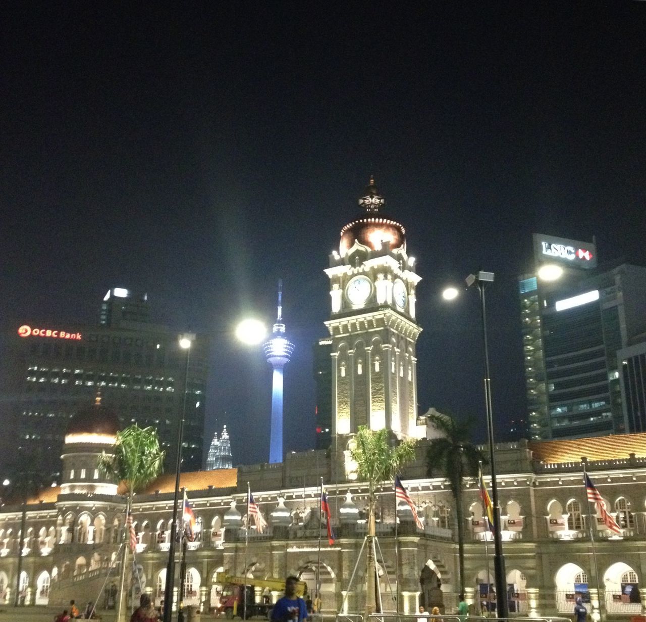 VIEW OF ILLUMINATED CITY AT NIGHT