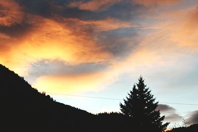 Low angle view of cloudy sky at sunset