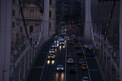 High angle view of traffic on road amidst buildings in city