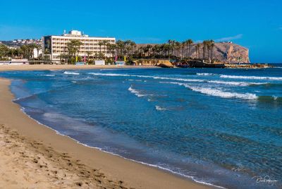 View of beach with buildings in background