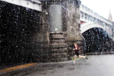 Wet glass in city during winter