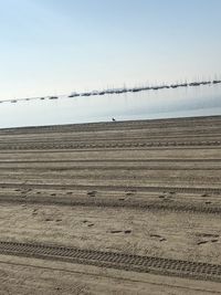 Scenic view of beach against clear sky