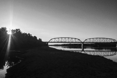 Sun shining through bridge