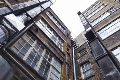 Low angle view of office building against sky