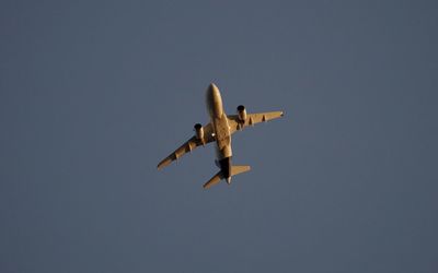 Low angle view of airplane flying in sky