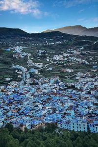 Aerial view of townscape against sky