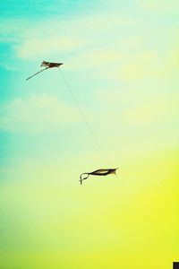 Low angle view of helicopter flying in sky