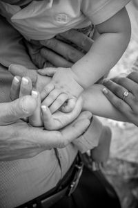 Close-up of family stacking hands