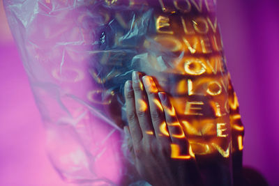 Close-up of hand on glass