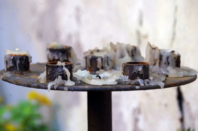 Close-up of old rusty machine on table