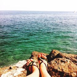 Low section of woman in sea