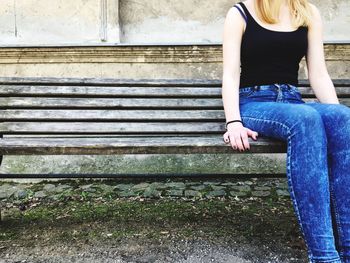 Low section of woman sitting on floor