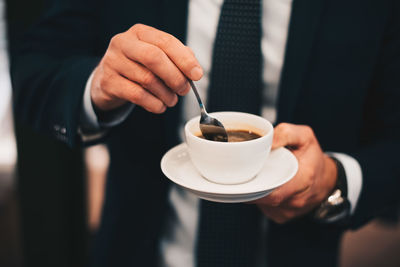 Man holding coffee cup