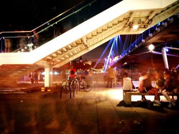 People sitting in restaurant at night