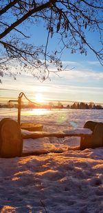 Scenic view of snowcapped mountains against sky during sunset