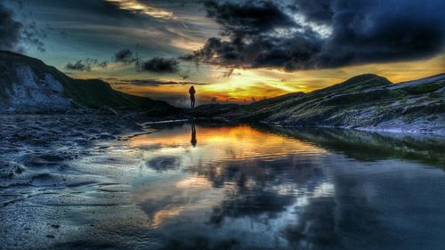 Scenic view of sea against cloudy sky