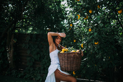 Midsection of man holding ice cream in basket