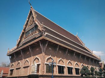 Low angle view of building against blue sky