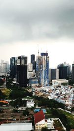 High angle view of buildings against sky in city