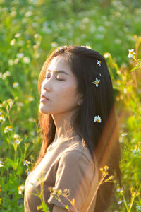 Portrait of young woman looking away