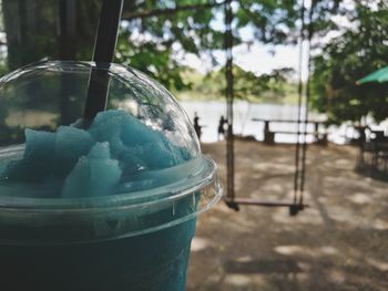 Close-up of drink in glass container on table