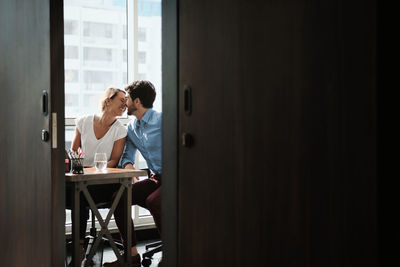 People sitting on chair at table