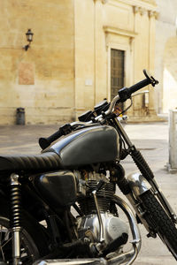 Close-up of bicycle parked on street