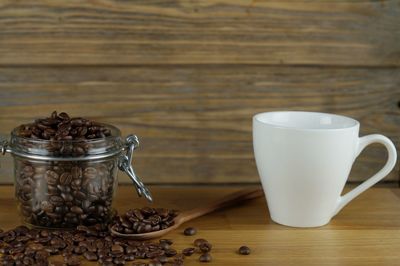 Coffee cup and spoon on table