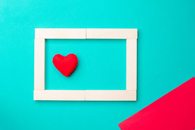 Close-up of heart shape against blue background