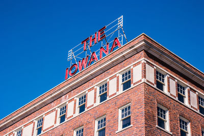 Low angle view of building against blue sky