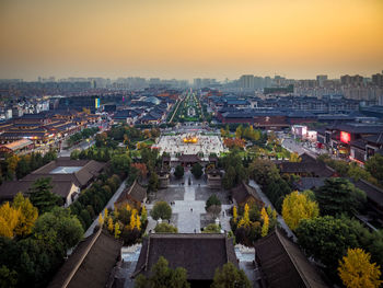 High angle view of city at sunset