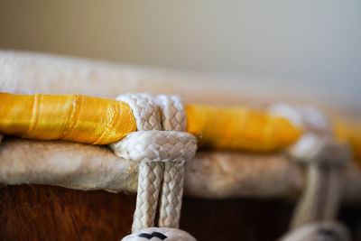 Close-up of rope tied on wood