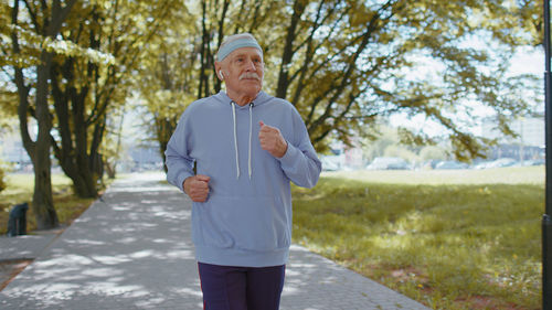 Dedicated senior man jogging in park