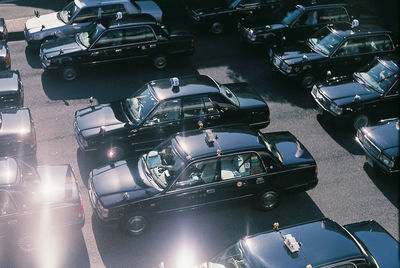 High angle view of cars parked on road in city