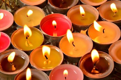 High angle view of lit candles