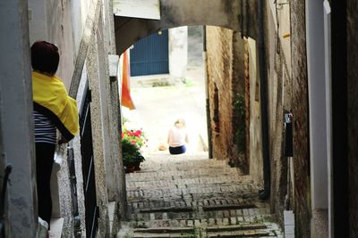 People walking in alley