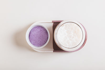 High angle view of beauty products against white background