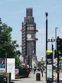 City street and buildings against sky