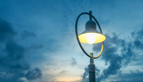 Low angle view of street light against sky