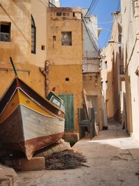 Alley amidst buildings in city