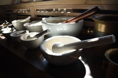 Close-up of mortar and pestles on table for safe at store