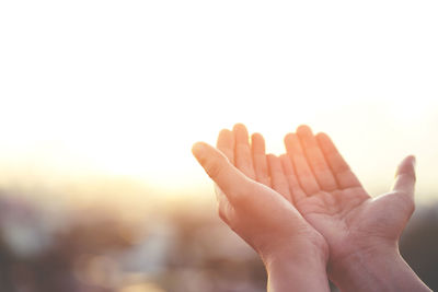 Close-up of hand against white background