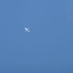 Low angle view of airplane flying in sky