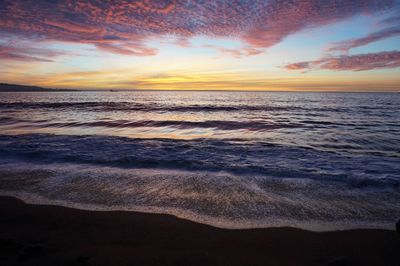 Scenic view of sea against dramatic sky