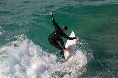 High angle view of man surfing in sea