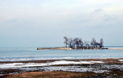 Scenic view of sea against sky during winter